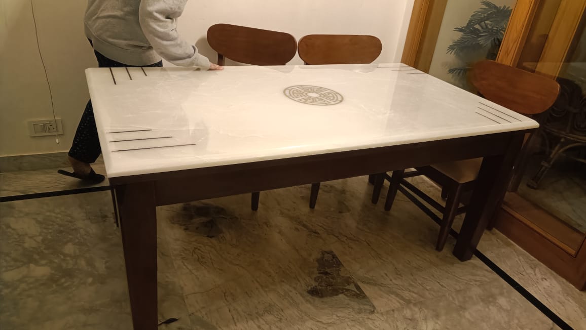 Customer photo of an inlay-top dining table in a client home