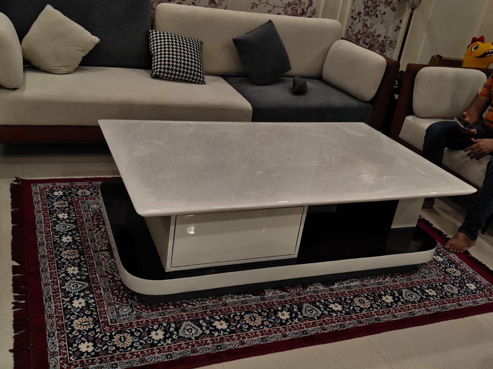 Customer photo of a marble center table with sofa in a client home