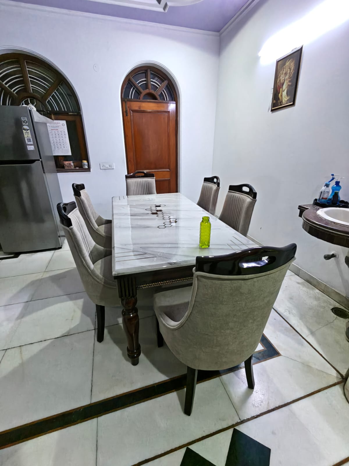 Customer photo of a six-chair dining set in a client home