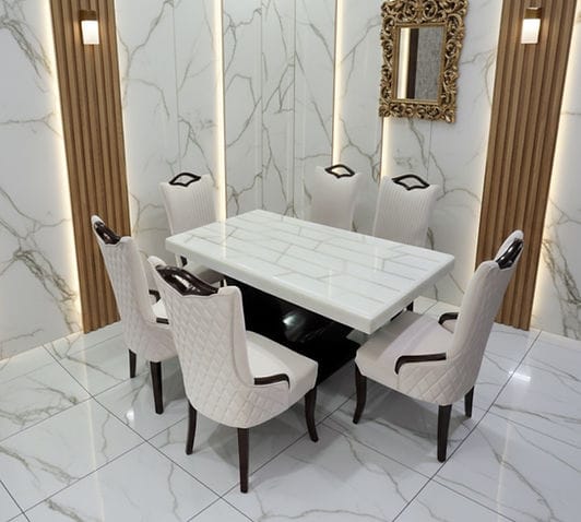 Marble dining set displayed in bright marble interior at MAC INTERIO gallery