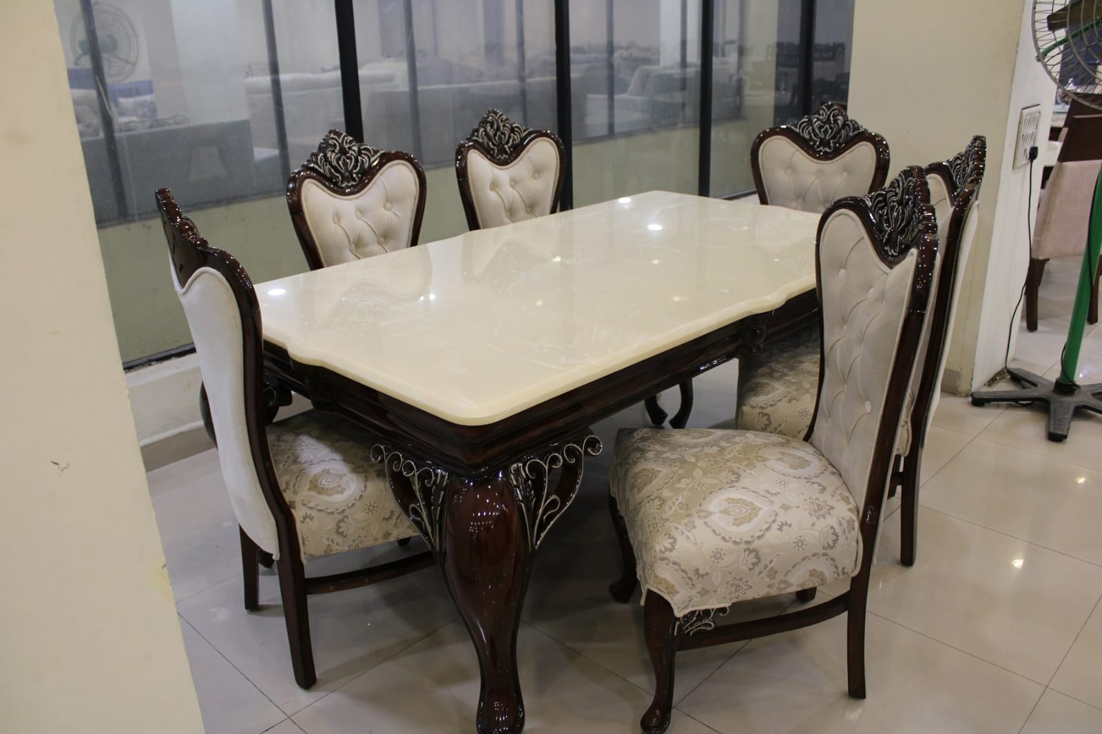 Classic polished-stone dining set with carved chairs crafted under founder Umar Faruq at MAC INTERIO
