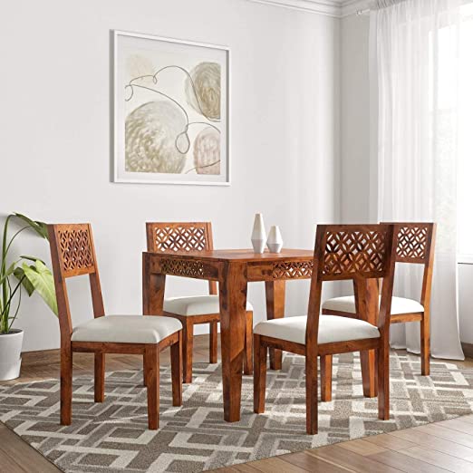 Solid wood four-seater dining table with lattice back chairs