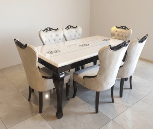 Minimal white marble six-seater dining table with black base